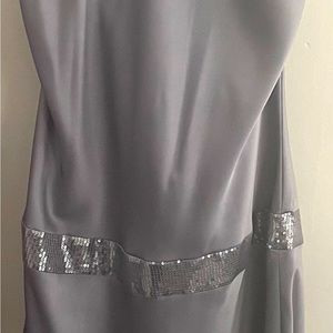 Sleak asymmetrical silver dress with sequence. Calvin Klein size 12.